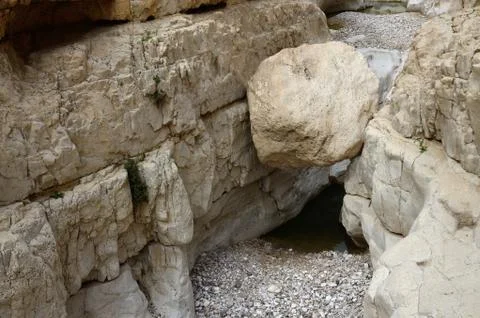 Big sphere stone in wadi Murabba'at canyon ,Judean desert, Israel, landmark Stock Photos