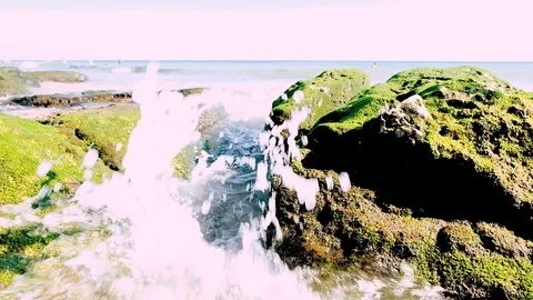 Big splash of tide wave coming to beach among two stones Stock-Footage 99136724