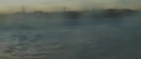 Big splashes of waves created by a boat sailing in the ocean near the city po Stock Footage 147565818