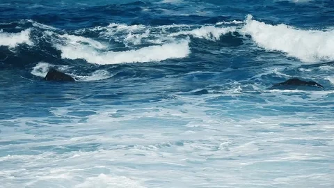 Big splashing ocean wave rushes towards the coast of an exotic island in the  Stock Footage 122425595