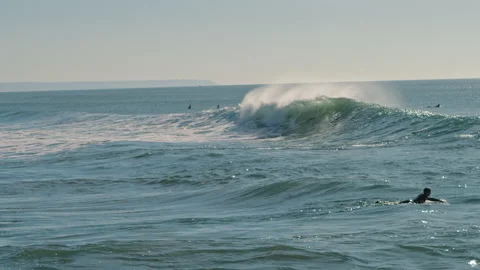 Big splashing ocean wave rushes towards the coast on a sunny day Stock Footage 130627040