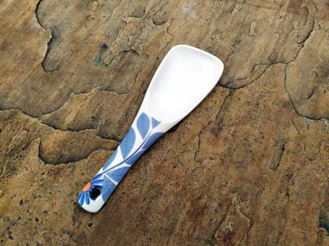 A big spoon on stone background Stock Photos