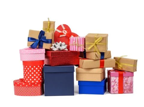 Big stack of gifts wrapped in brown kraft paper and tied with silk blue and r Foto stock
