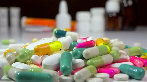 Big stack of medicine, pills, tablets + flasks, bottles and tubes - zoom out Stock Footage 59877985