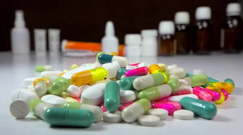 Big stack of medicine, pills, tablets + flasks, bottles and tubes - zoom in Stock Footage 59893391