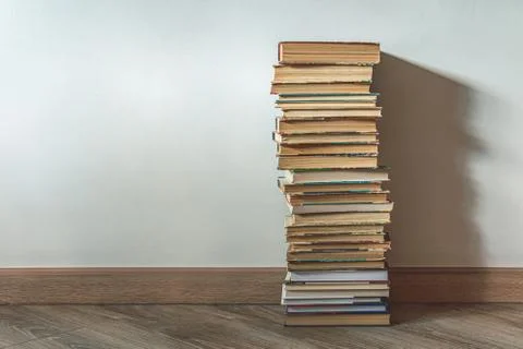 Big stack of old books over white wall Stock Photos