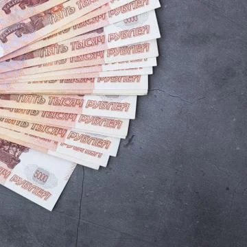 Big stack of Russian money banknotes of five thousand rubles lying fan on a g Stock Photos
