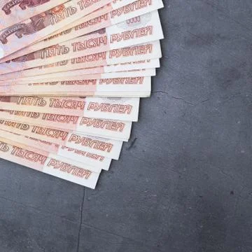Big stack of Russian money banknotes of five thousand rubles lying fan on a g Stock Photos