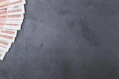 Big stack of Russian money banknotes of five thousand rubles lying fan on a g Stock Photos