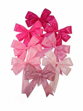 Big stack of Shiny pink satin ribbon on a white background. Magenta bow. Stock Photos