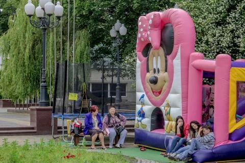 Big standing inflatable Mickey mouse in Parade Stock Photos