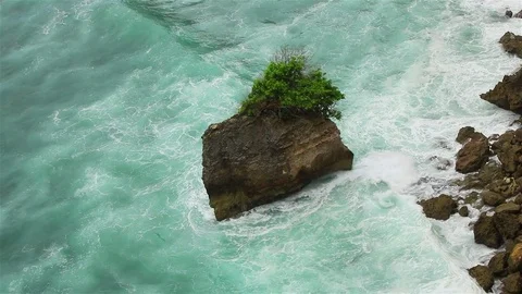 A big stone and ocean waves Stock Footage 72447721