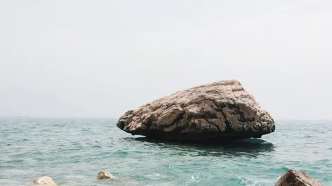 Big stone in the sea Stock Footage 111786501