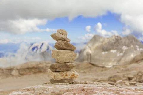 Big stone tower in mountains height show balance stability power. Stones stac Stock Photos