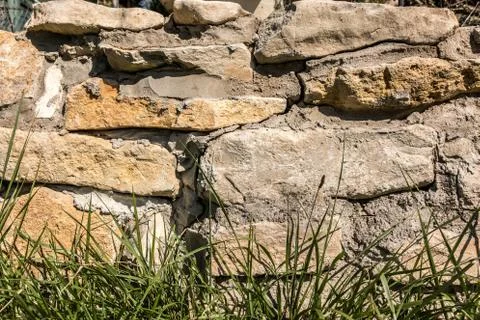 Big stone wall in the garden Stock Photos