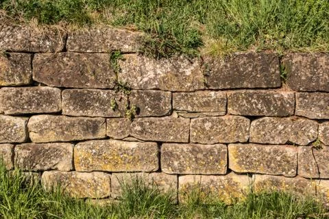 Big stone wall in the garden Stock Photos