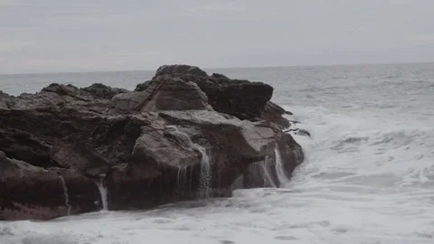 Big storm waves hitting the shore. Sea waves crashing on the rocks during the Stock Footage 85285879