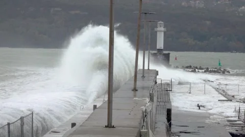 Big stormy wave splash on pier. Waves crashing on breakwaters. Stock Footage 257397781