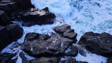 Big strong waves crashing against to sharp rock of the Isle of Skye in Scotland. Stock Footage