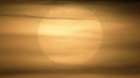 The big sun behind the clouds, time lapse. Stock Footage 219715959