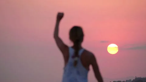 Big sun. Blurred defocus silhouette of girl on background of dawn or sunset. Stock Footage 134844734