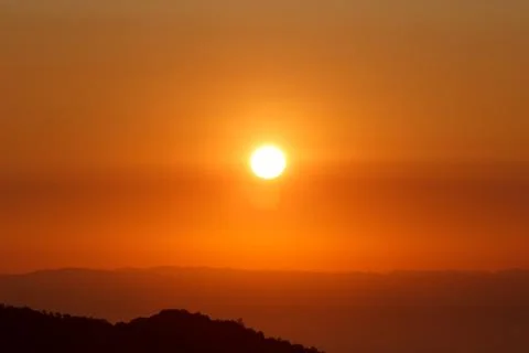 Big sun on the mountain Stock Photos