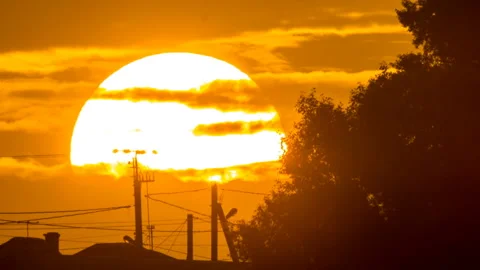 Big sun sets over the horizon Stock Footage 98764208