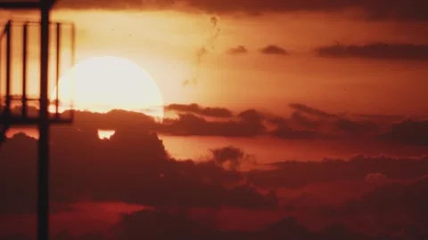 Big sun at sunset in real time Stock Footage 316537987