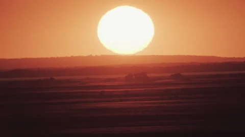 Big sun at sunset without clouds Stock Footage 243528937