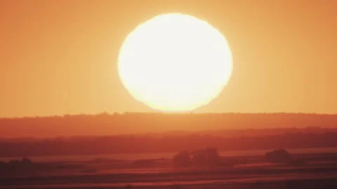 Big sun at sunset without clouds Stock Footage 244224963