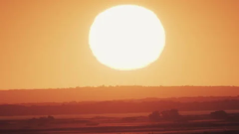 Big sun at sunset without clouds Stock Footage 244717630