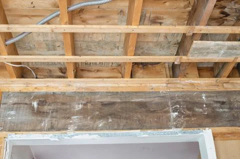 A big support beam holding upper ceiling of a house Stock Photos