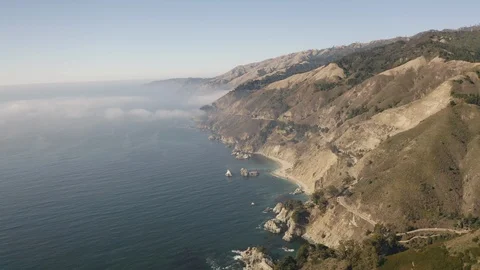Big Sur Mountainside alongside Pacific Ocean Coastline Aerial Drone Stock Footage 126008410