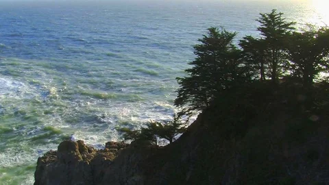 Big Sur waves, coastal view with silhouette of trees, rocks and cliff Stock Footage 72326815