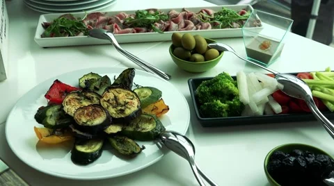 Big table with various meals in the restaurant - nobody Stock-Footage 67425132