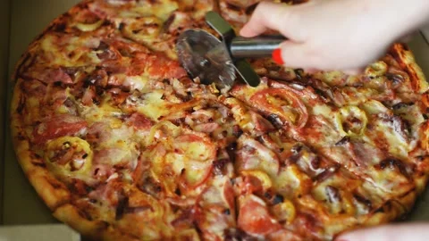 Big tasty italian pizza cut into pieces Stock Footage