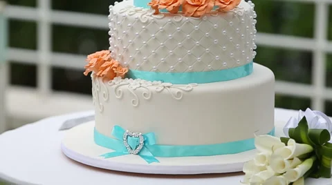 Big three tiered wedding cake decorated with fresh flowers, selective focus Stock-Footage 66443472