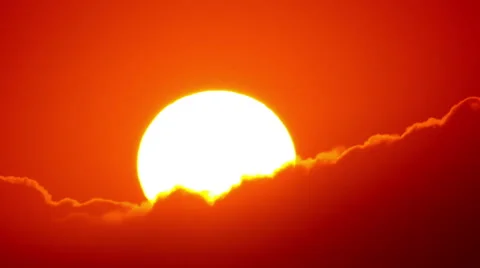 Big time lapse sun setting through clouds with silver lining Stock Footage 55394949