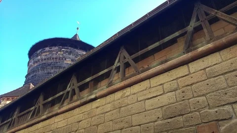 A big tower behind a wall in nuremberg germany 動画素材 81183805