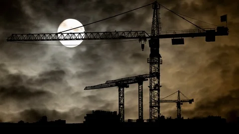 Big Tower Crane in Construction Site: Time Lapse in Dark Night with Full Moon Stock Footage 118515475