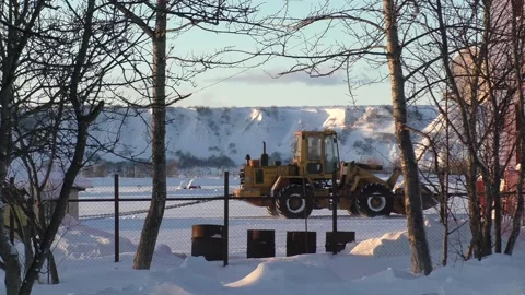 Big tractor cleans the snow Stock Footage 223145800