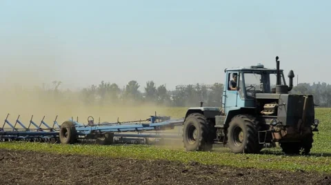 Big Tractor Plowing The Summer Field Stock Footage 40705230