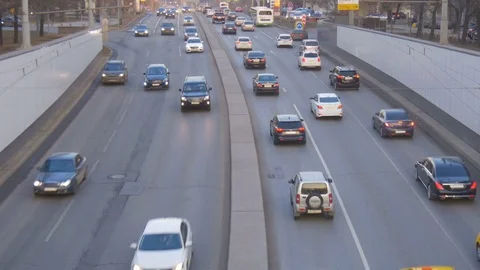 A big traffic of cars, in the evening on city streets Stock Footage