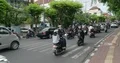 Big traffic at main road crossing with lot of vehicles and motorbikes in Bali 4k or 4k+ Resolution