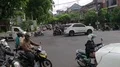 Big traffic at main road crossing with lot of vehicles and motorbikes in Bali 4k or 4k+ Resolution