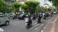 Big traffic at main road crossing with lot of vehicles and motorbikes in Bali 4k or 4k+ Resolution