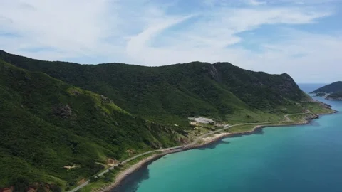Big trash dump is in front of the sea on a beautiful remote tropical island. Stock Footage 164369448