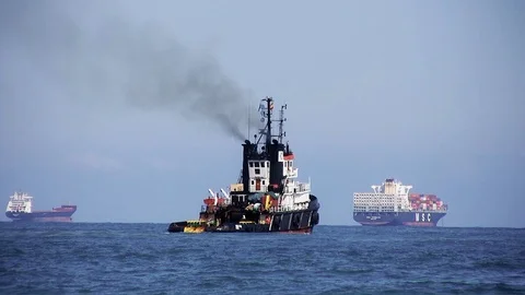 Big tug helping in shipwreck in the beach of Valencia city. Stock Footage 108783048