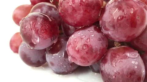 Big view: A lot Red Grapes White background wet water droplet, authentic motion Stock Footage 80780461