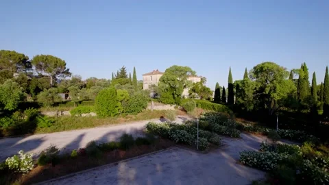 Big villa being shown that is hidden behind some trees. Stock Footage 201247467